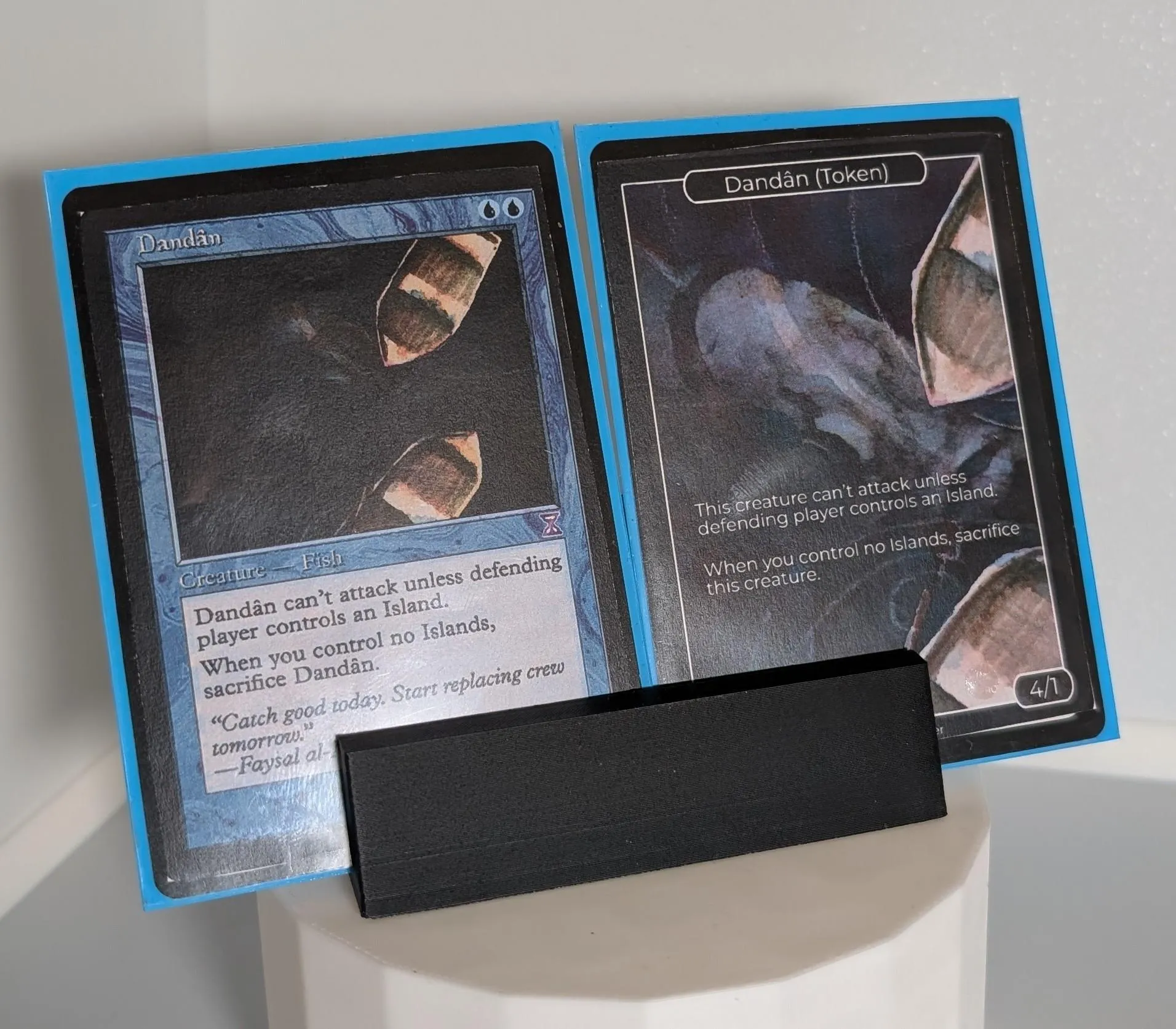 Two Magic the Gathering cards: original Dandân on the left and custom Dandân token with zoomed in full art from the original card on the right.
