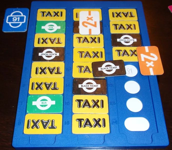 A three column, 24 slot score card with empty circles where you can write into and used slots covered with taxi, bus and black tickets