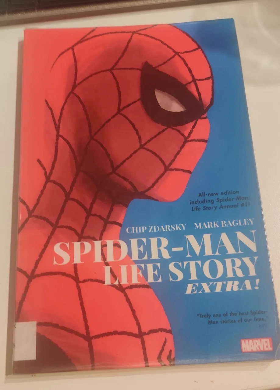 Comic book Spider-Man: Life Story by Chip Zdarsky and Mark Bagley with side looking Spider-Man torso on the cover with a blue background.